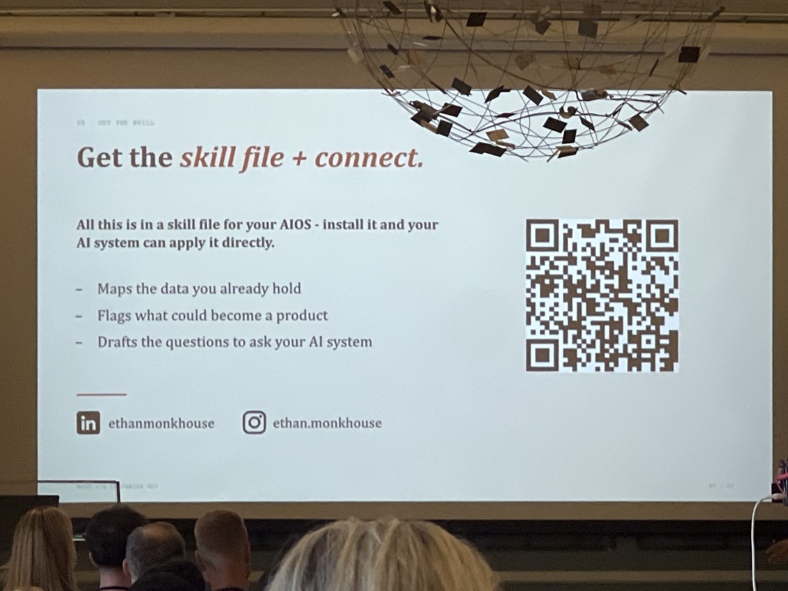 "Get the skill file + connect" - the handout QR and his handles